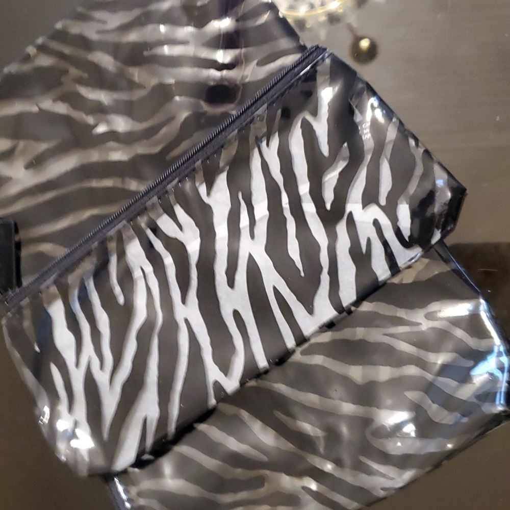 2 New plastic Estee Lauder makeup cases with zipper closure